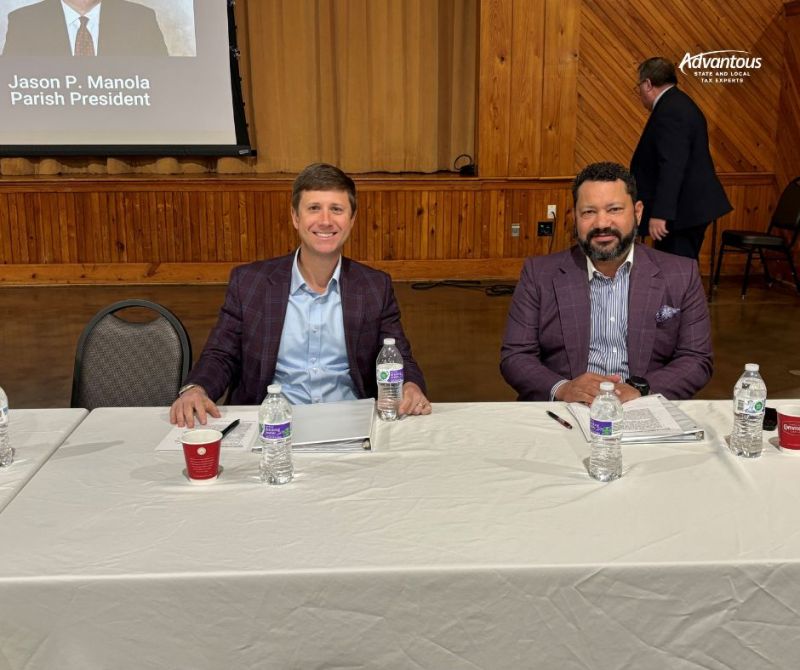 Jason DeCuir sitting next to Will Green at the WBRC State of the Parish Address panelists table