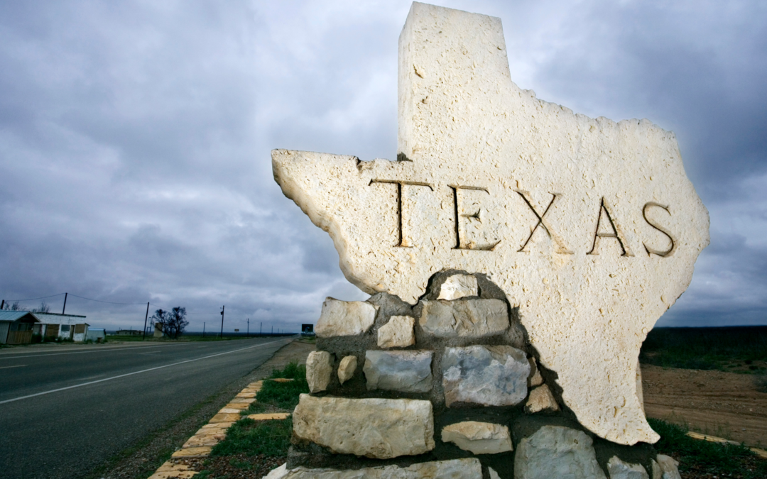 Picture of Texas cut out of a rock and engraved with the name Texas